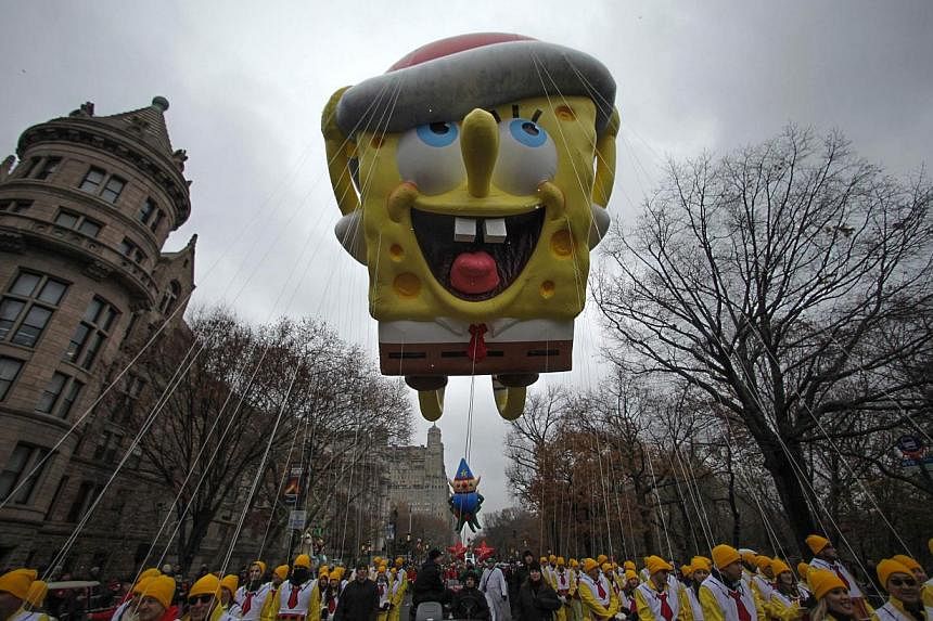 A SpongeBob Squarepants balloon floats down Central Park West during the 88th Macy's Thanksgiving Day Parade in New York Nov 27 last year. -- PHOTO: REUTERS