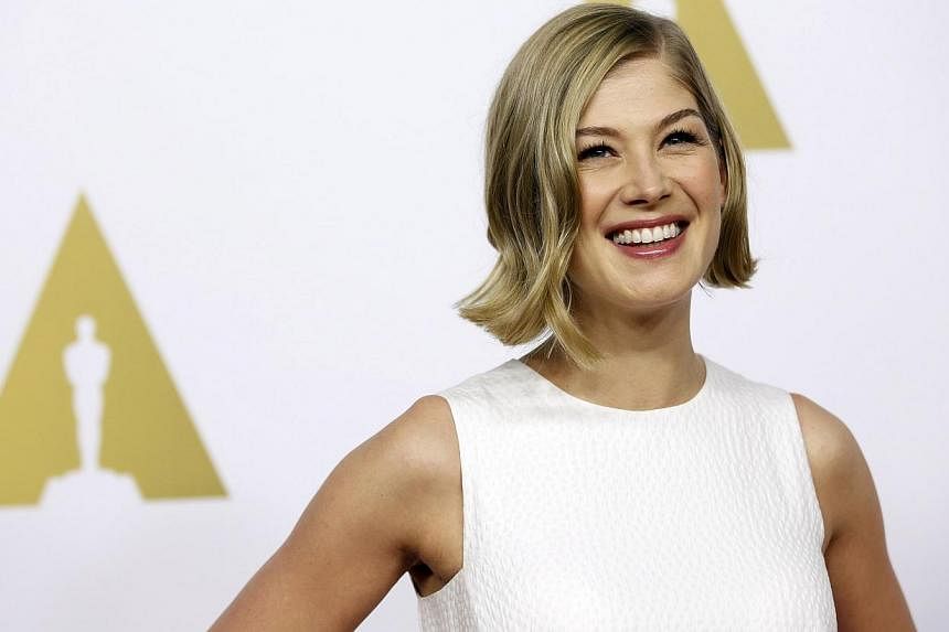 Rosamund Pike, best actress nominee for her role in the film Gone Girl, arrives at the 87th Academy Awards nominees luncheon in Beverly Hills, California on Feb 2, 2015. -- PHOTO: REUTERS