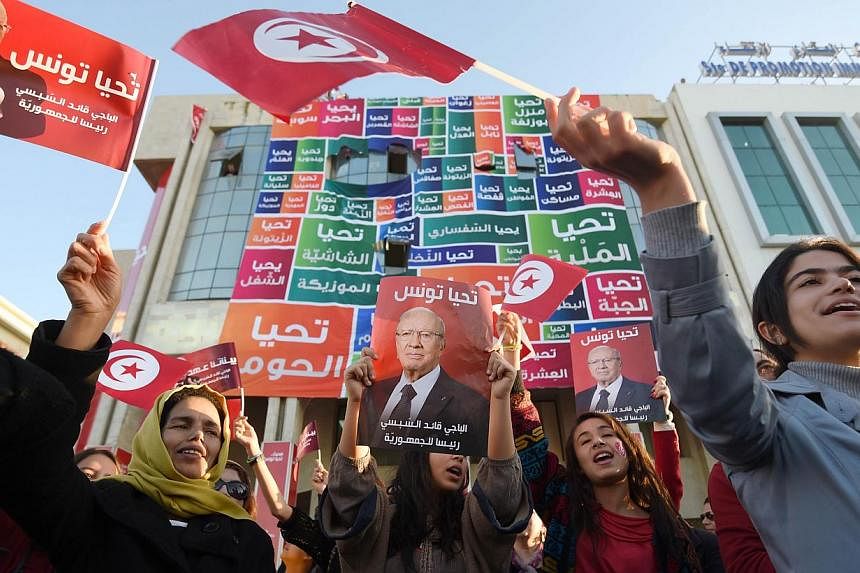 Supporters of Tunisia's newly-elected President Beji Caid Essebsi on Dec 22. The country was where the Arab Spring movement began. However, naive Western responses to the movement, along with the ill-considered 2003 American intervention in Iraq, bro