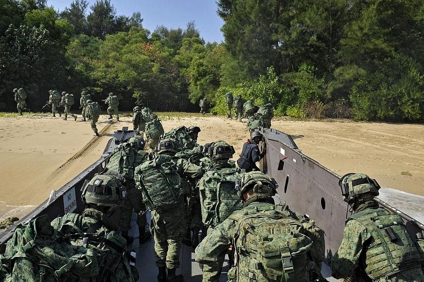 Servicemen from the Singapore Armed Forces (SAF) participating in a military exercise on Pulau Sudong on Aug 2, 2011. Defence Minister Ng Eng Hen recently paid tribute to efforts of the pioneer batch of soldiers, airmen and sailors who have built the