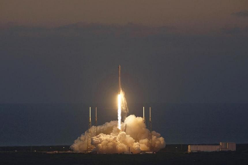The unmanned Falcon 9 rocket, launched by SpaceX and carrying NOAA's Deep Space Climate Observatory Satellite, lifts off from launch pad 40 at the Cape Canaveral Air Force Station in Cape Canaveral, Florida on Feb 11, 2015. -- PHOTO: REUTERS