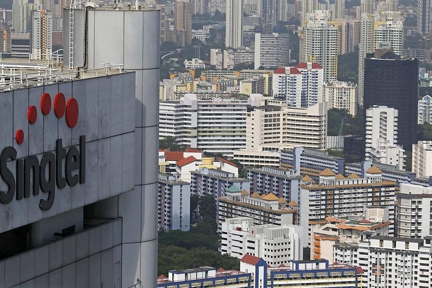 Singtel reported a $970 million third-quarter net profit, an 11 per cent rise, on strong performance at home and higher contributions from its regional associates. -- PHOTO: REUTERS