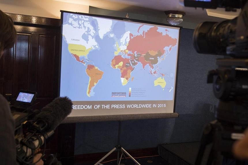Journalists filming a map showing the World Press Freedom Index 2015 during a press conference at the National Press Club in Washington, DC, on Feb 11, 2015. -- PHOTO: AFP