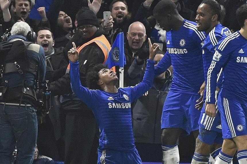 Willian (centre) of Chelsea celebrating after scoring against Everton at Stamford Bridge, London, on Feb 11, 2015. -- PHOTO: REUTERS