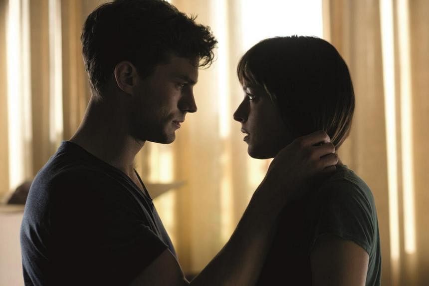 Jamie Dorman and Dakota Johnson star in Fifty Shades Of Grey. -- PHOTO: UNIVERSAL PICTURES&nbsp;