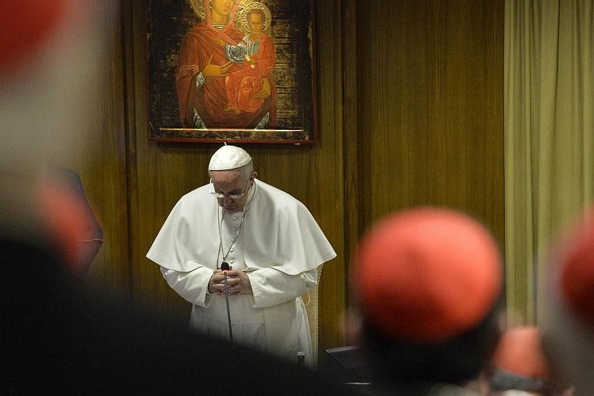 Pope Francis addresses cardinals and bishops at the opening of the Papal consistory at the Vatican on Feb 12, 2015. -- PHOTO: AFP