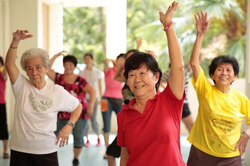 Elderly residents at Thye Hua Kwan Seniors Activity Centre in Bukit Merah practise zumba moves during a session of the Get Movin' for Charity zumba programme. While the Housing Board completed the construction of 11 senior activity centres at studio 