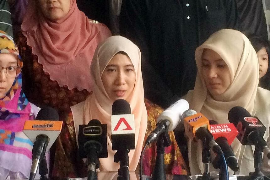 Nurul Nuha Anwar (centre), Anwar Ibrahim's daughter, speaking at a press conference at Anwar's house in Kuala Lumpur on Feb 11, 2015. She was unveiled yesterday as the face of the "March to Freedom" campaign, aimed at ratcheting up pressure at home a