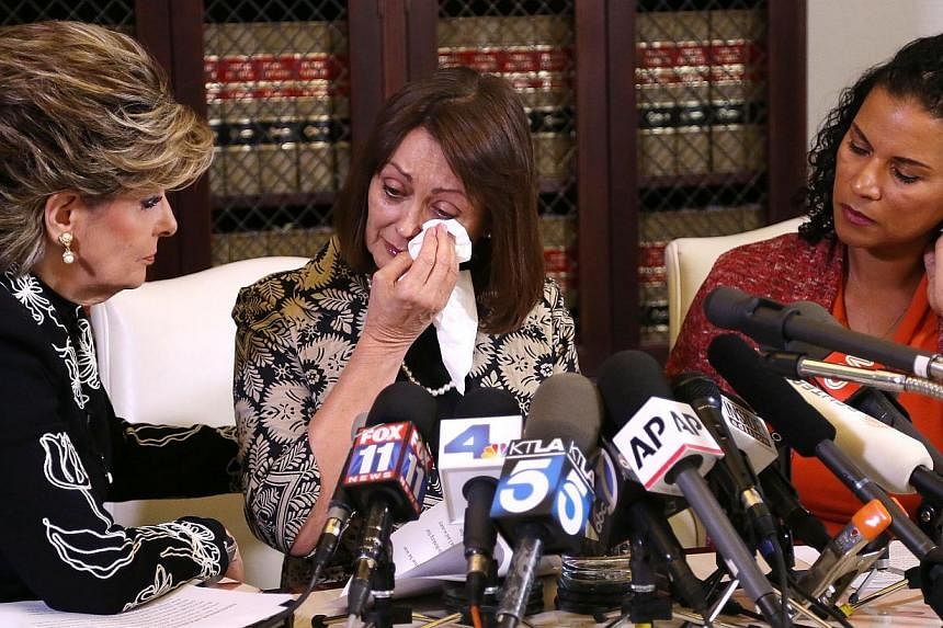 Linda Brown (centre) and Lise-Lotte Lublin (right), two alleged victims of Bill Cosby, speaking during a news conference with attorney Gloria Allred (left) on Feb 12, 2015 in Los Angeles, California. -- PHOTO: AFP