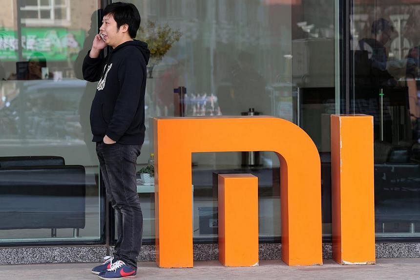 Xiaomi, China's largest smartphone company, will begin selling headphones, smart wristbands and other accessories online in the United States in the coming months, taking its first tentative step onto Apple home turf. -- PHOTO: EPA