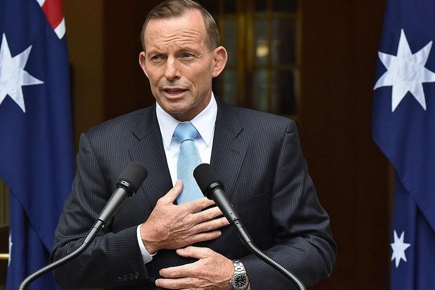 Australian Prime Minister Tony Abbott came under fire on Feb 13, 2015, over controversial comments on the arrest of two terror suspects and for referring to a "holocaust" of job losses, capping a horror week. -- PHOTO: BLOOMBERG