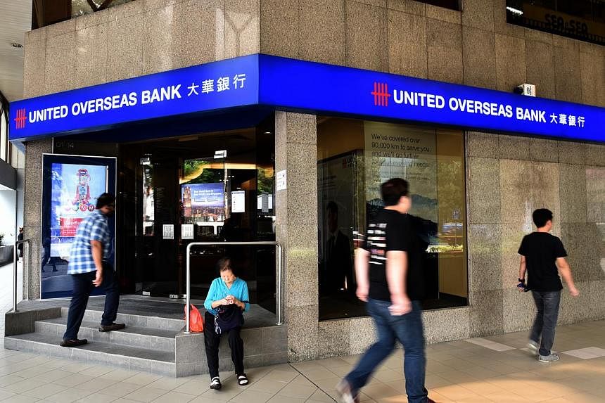 UOB Group said its net profit of $786 million for the fourth quarter of its 2014 financial year is 1.7 per cent higher than a year ago, on strong loan growth. -- PHOTO: ST FILE