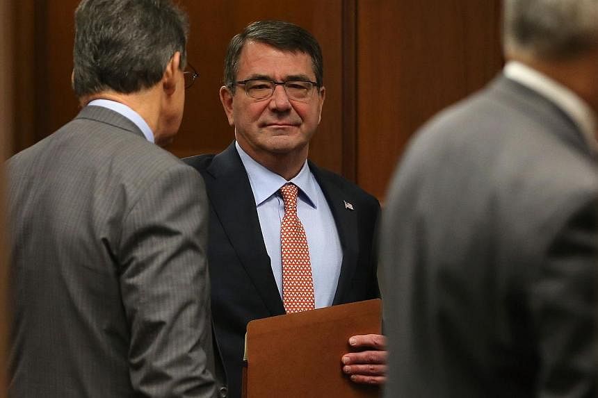 Ashton Carter (above), a hard-charging intellectual known for blunt talk, was confirmed as US defence secretary Thursday, and he could soon find himself at odds with a White House that clashed with previous Pentagon chiefs. -- PHOTO: AFP