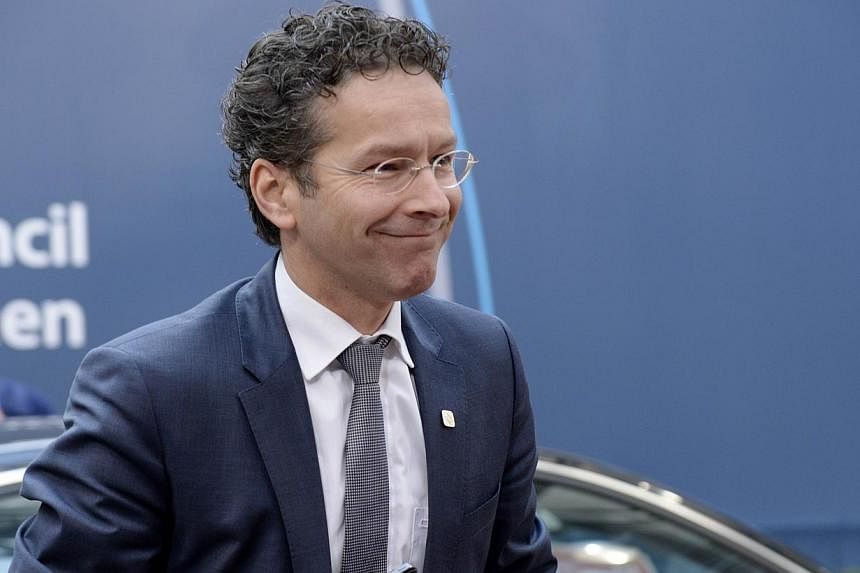 Greek Prime Minister Alexis Tsipras and Eurogroup head Jeroen Dijsselbloem (above) agreed Thursday to renew efforts to resolve a bitter row over extending Greece's current bailout after talks overnight collapsed acrimoniously. -- PHOTO: AFP