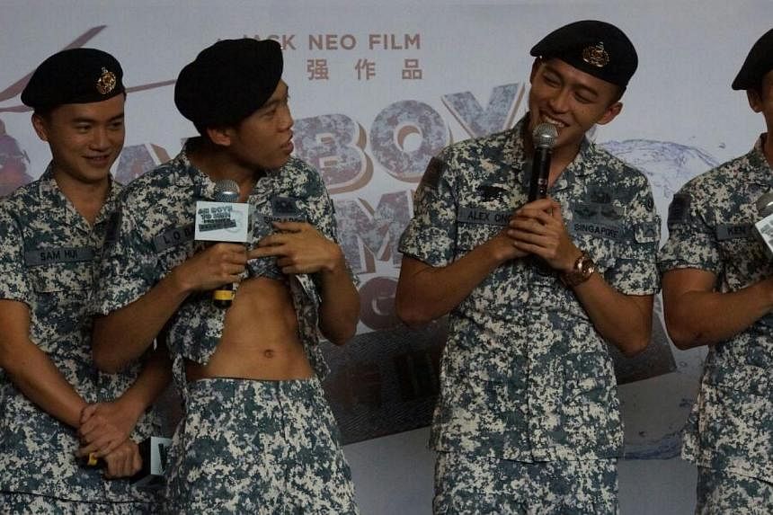 Ah Boy actor Wang Weiliang (second from left) shows off his abs, next to him on the right is Tosh Zhang, and Joshua Tan. -- ST PHOTO: GWENDOLYN NG &nbsp;