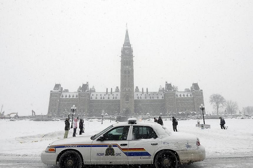 A Royal Canadian Mounted Police vehicle at Parliament Hill in Ottawa on Feb 4, 2015. Canadian police said on Feb 13 that they had foiled a plot that would have seen an armed duo carry out a shooting spree in the city of Halifax on Valentine's Day. --