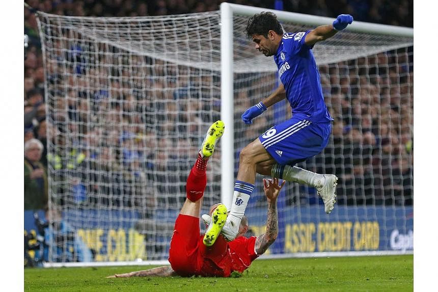 Chelsea's Diego Costa (top) appears to stamp on Liverpool's Martin Skrtel during their English League Cup semi-final second leg soccer match at Stamford Bridge in London Jan 27, 2015. -- PHOTO: REUTERS