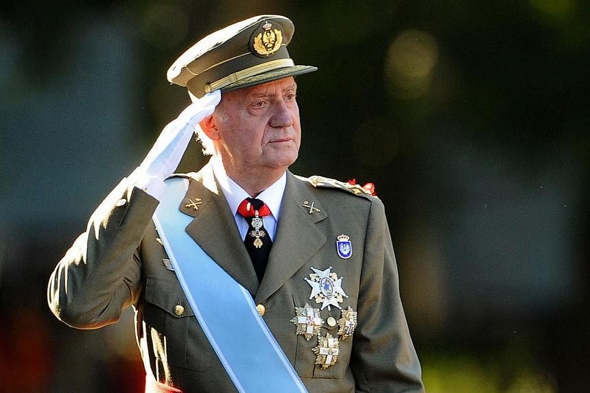 Spain's former king Juan Carlos, seen here in this Oct 12, 2011, file photo, has lodged an appeal against a paternity suit brought by a woman claiming to be his daughter, a judicial source said on Saturday. -- PHOTO: AFP