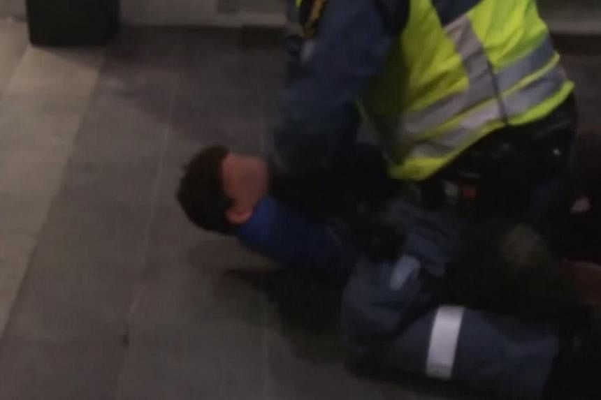 A screenshot from online footage of the incident in&nbsp;Malmoe central station.&nbsp;Video footage of a Moroccan boy begging for mercy as a security guard bangs his head against a brick floor has shocked Sweden as the country grapples with a record 