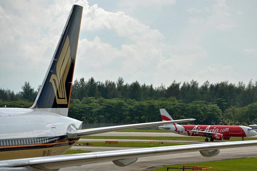 More airlines are cutting or removing fuel surcharges amid a sharp fall in oil prices in recent months, with Singapore Airlines among them. -- PHOTO: ST FILE