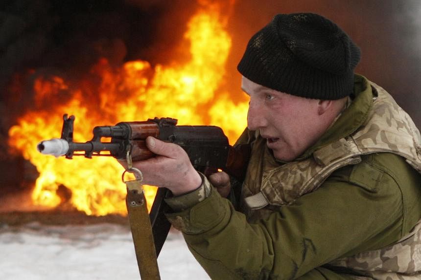 A newly mobilised soldier trains with a weapon at a Ukrainian ground forces training centre in the Chernihiv region Feb 13, 2015. The United States charged Friday that Russia was continuing to deploy heavy weapons in eastern Ukraine, before a ceasefi