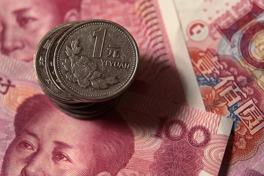 China's yuan declined the most in two weeks as the foreign-exchange regulator highlighted concerns over capital outflows amid indications money is leaving the nation. -- PHOTO: REUTERS&nbsp;
