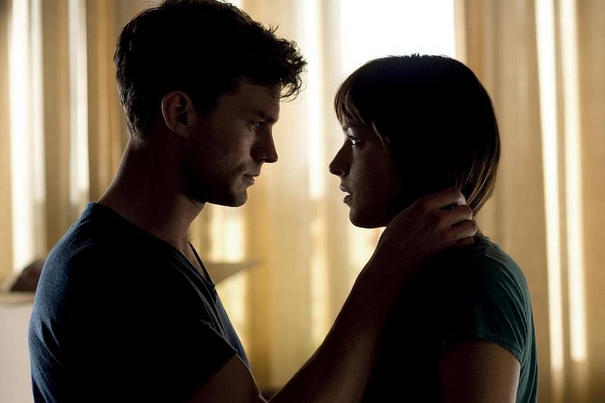 Jamie Dornan and Dakota Johnson star in Fifty Shades Of Grey. -- PHOTO: UNIVERSAL PICTURES