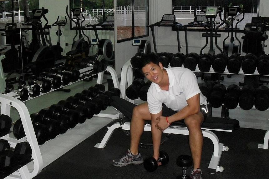 Lifting weights at his first gym, Unleash Fitness, in 2009.&nbsp;--&nbsp;PHOTO: COURTESY OF CHUNG TZE KHIT