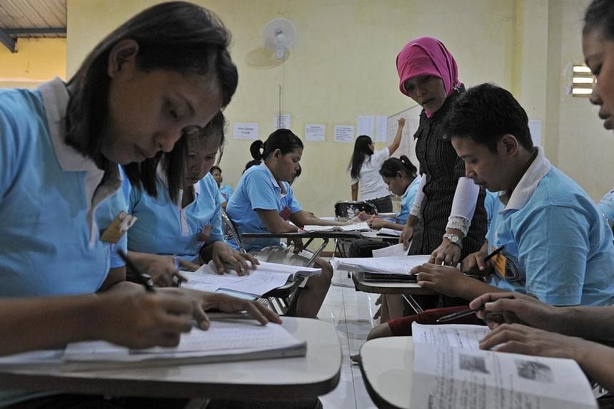 Indonesian maids undergoing training at a training centre in Solo, Indonesia, in 2011. -- PHOTO: ST FILE