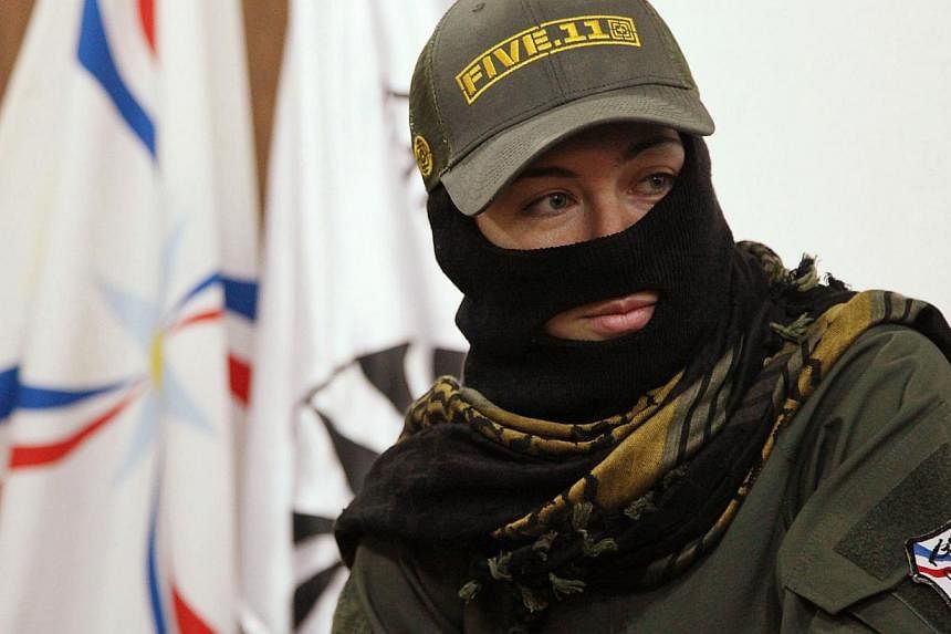 A foreign female fighter who has joined the Iraqi Christian militia Dwekh Nawsha to fight against ISIS militants sits at the office of the Assyrian political party in Dohuk, northern Iraq on Feb 13. The only foreign woman in Dwekh Nawsha's ranks said