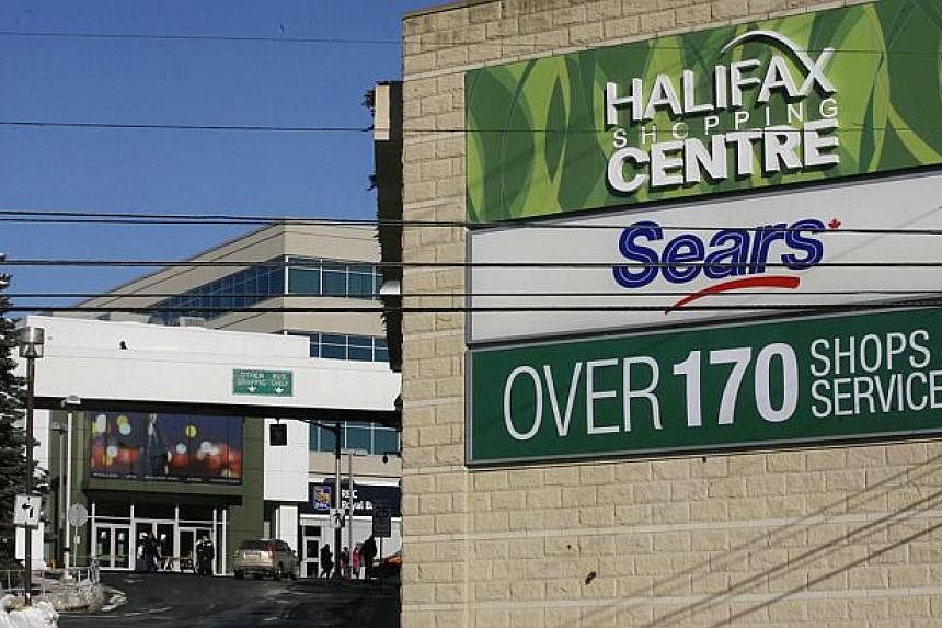 Police cars are seen outside the Halifax Shopping Centre, which was named by police as the intended target of an attack which they said was thwarted in Halifax, Nova Scotia on Valentine's Day. -- PHOTO: REUTERS