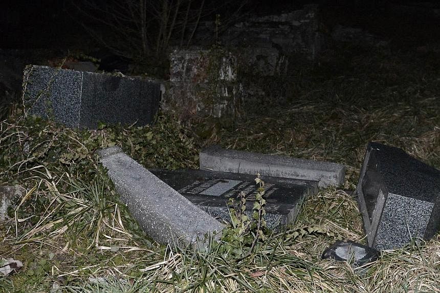 A defaced tombstone at the Jewish cemetery of Sarre-Union, northeastern France in a photo taken on Sunday.France's interior minister said that several hundred tombs had been defaced at the Jewish cemetery, in what he called "a despicable act". &nbsp;
