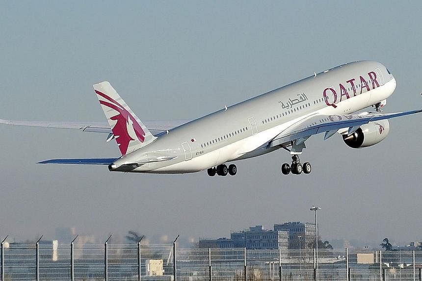 In June, Doha-based Qatar Airways will add a third daily flight to Changi Airport, and by August all three flights will be operated with the Airbus 350 - the newest wide-body aircraft in the market. -- PHOTO: AFP&nbsp;