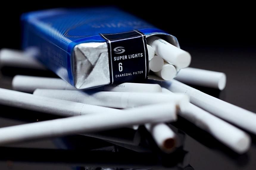 Studies on the health impact of "plain" or standardised cigarette packs suggest they can deter non-smokers from taking up the habit and may cut the number of cigarettes smokers get through, scientists say. -- PHOTO: BLOOMBERG&nbsp;