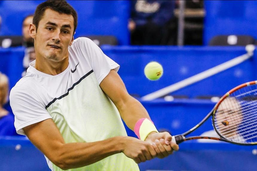 Bernard Tomic of Australia hits a return shot to Alexandr Dolgopolov (above) of Ukraine in their quarter-round Memphis Open tennis match at the Racquet Club of Memphis in Memphis, Tennessee, US, on Feb 12, 2015. -- PHOTO: EPA