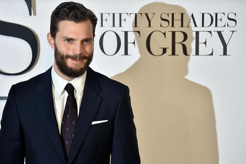 British actor Jamie Dornan poses for photographers ahead of the UK Premiere of Fifty Shades of Grey in central London on Feb 12, 2015. Netflix next year will release Jadotville, a war film starring the 50 Shades Of Gray star. -- PHOTO: AFP&nbsp;