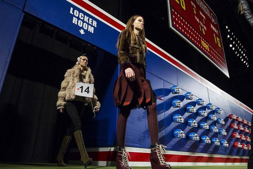 Models enter the arena during rehearsals for the Tommy Hilfiger Fall/Winter 2015 collection presentation at the New York Fashion Week on Feb 16, 2015. -- PHOTO: REUTERS