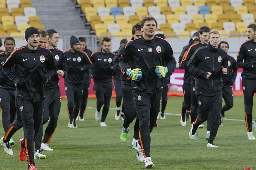 Shakhtar Donetsk's players take part in a training session at the Lviv Arena stadium in Lviv on Feb 16, 2015.&nbsp;The team is hoping a surprise Champions League victory over 2013 winners Bayern Munich on Tuesday can bring some brief cheer to their t
