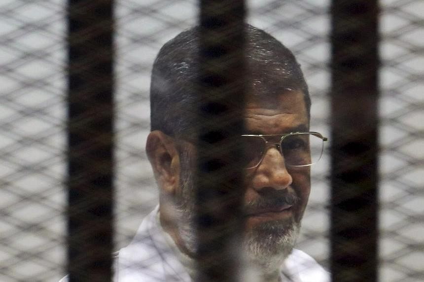 An Egyptian military court will try deposed president Mohamed Morsi (above) and 198 Islamist leaders and supporters over a deadly protest in 2013 following his overthrow, a prosecution source said Tuesday. -- PHOTO: REUTERS