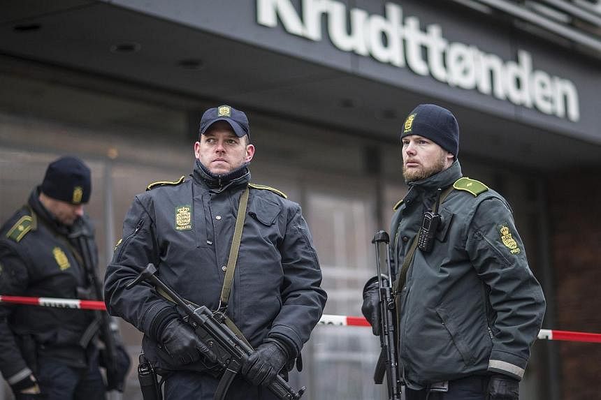 Police guard the scene of a shooting at cafe 'Krudttonden,' which was hosting a free speech event, in Oesterbro, Copenhagen, on Feb 16, 2015.&nbsp;A suspect package was found outside the cafe and the area has been evacuated, police there told a Reute