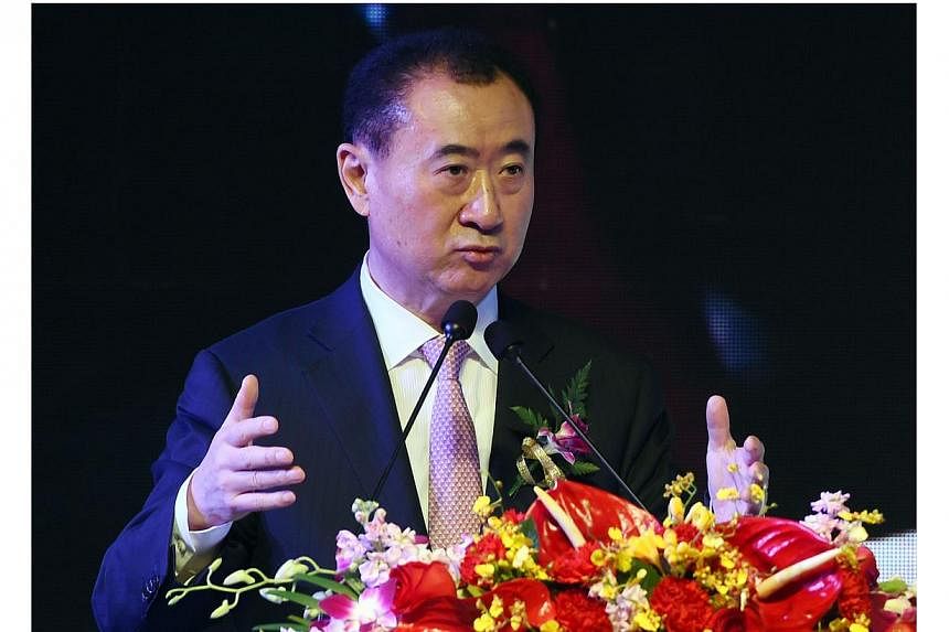 The son of China's second-richest man Wang Jianlin (above), Wang Sicong, is at the centre of a media storm after telling reporters that his top criterion for choosing a girlfriend was that she had to be "buxom".&nbsp;&nbsp;-- PHOTO: AFP