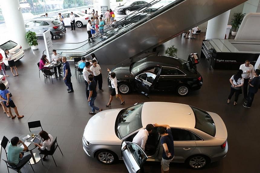 Motor traders expect the latest results to fuel a minor buying frenzy, but with most showrooms closed for an extended period for Chinese New Year, there will be a shorter than usual period to collect bookings. -- PHOTO: ST FILE