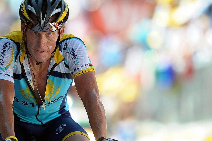US rider Lance Armstrong of the Astana team crossing the finish line of the 15th stage of the Tour de France cycling race between Pontarlier and Verbier, Switzerland on July 19, 2009. -- PHOTO: EPA