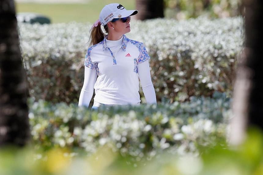 Paula Creamer walks to the fourth tee during round two of the Pure Silk Bahamas LPGA Classic at the Ocean Club course &nbsp;in Paradise Island, Bahamas on Feb 7, 2015. -- PHOTO: AFP&nbsp;