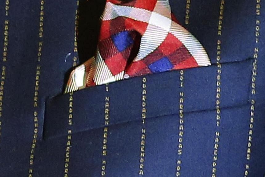 A close-up view of Indian Prime Minister Narenda Modi's dark pinstripe suit, repeatedly embroidered with the words "Narendra Damodardas Modi". -- PHOTO: REUTERS&nbsp;