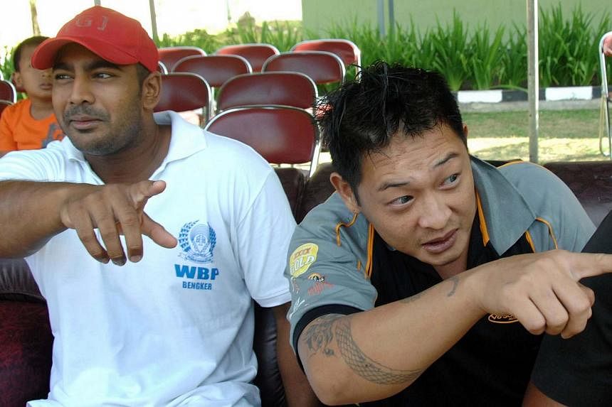 Convicted Australian drug smugglers Myuran Sukumaran (left) and Andrew Chan (right) sit inside Kerobokan prison in Denpasar, Bali. Chan, who is on death row in Indonesia, has lost his appeal for presidential clemency, his final chance to avoid the fi