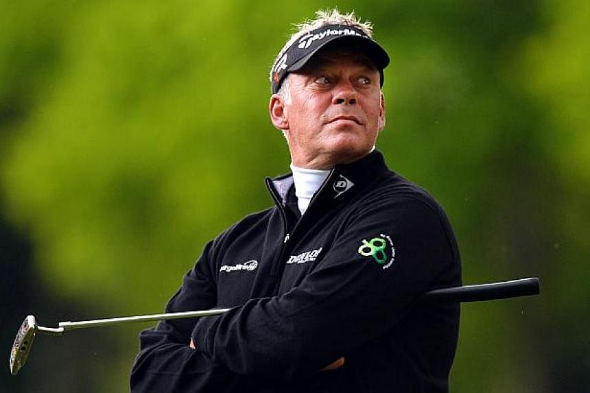 In a file picture taken on May 24, 2013, Northern-Irish golfer Darren Clarke looks on as he waits to putt on the15th green during the second round of the PGA Championship at Wentworth Golf Club in Surrey, England. Clarke has been appointed captain of