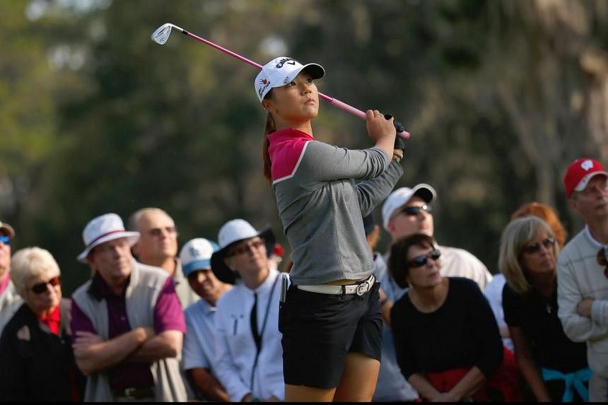 Lydia Ko of New Zealand watches her tee shot on the 11th hole at the Coates Golf Championship Presented by R+L Carriers - Final Round at the Golden Ocala Golf &amp; Equestrian Club on Jan 31, 2015, in Ocala, Florida. -- PHOTO: AFP
