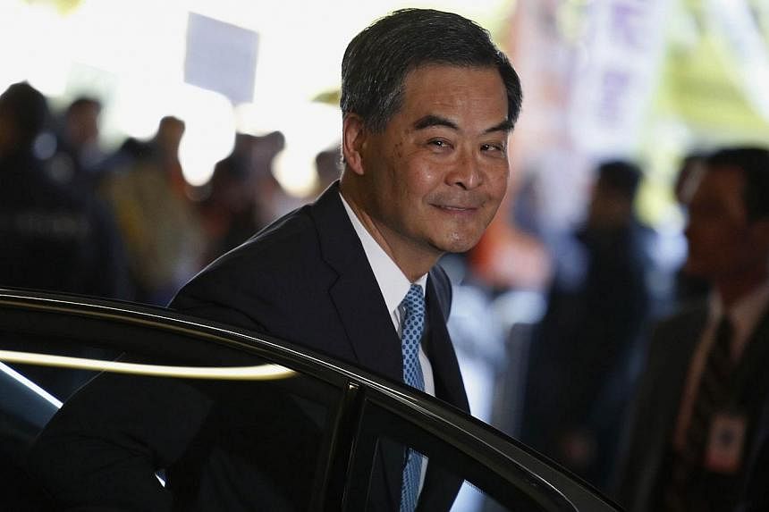 Hong Kong Chief Executive Leung Chun-ying arriving at the Legislative Council where protesters demonstrate, to give his annual policy address in Hong Kong Jan 14, 2015. He has has told residents in his Lunar New Year address to be "inspired" by this 