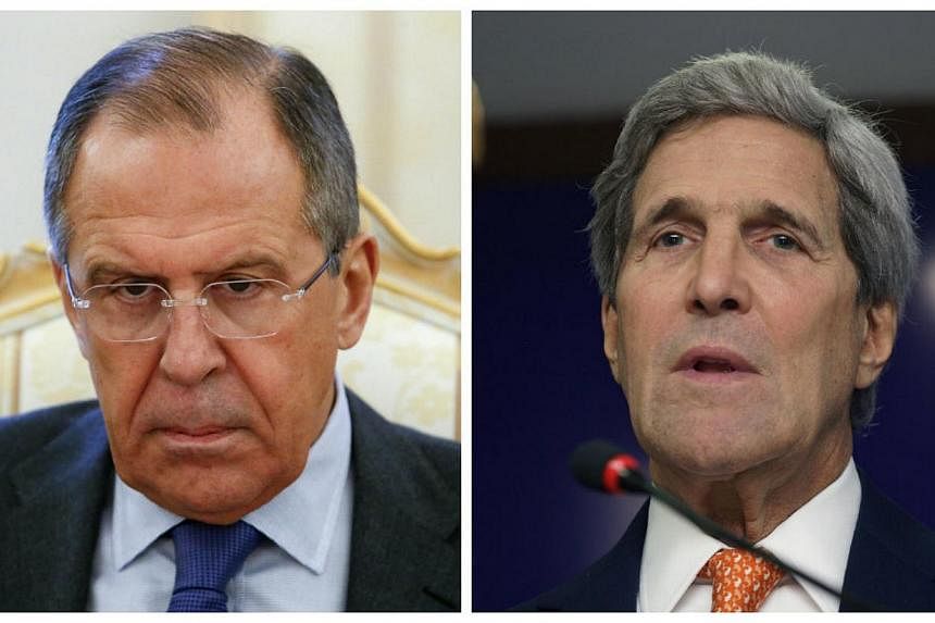 US Secretary of State John Kerry (right) and Russian Foreign Minister Sergei Lavrov (left) discussed over the phone on Wednesday the implementation of a peace deal to end the conflict in east Ukraine. -- PHOTOS: REUTERS